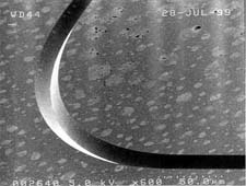 Curved V-shaped microgroove